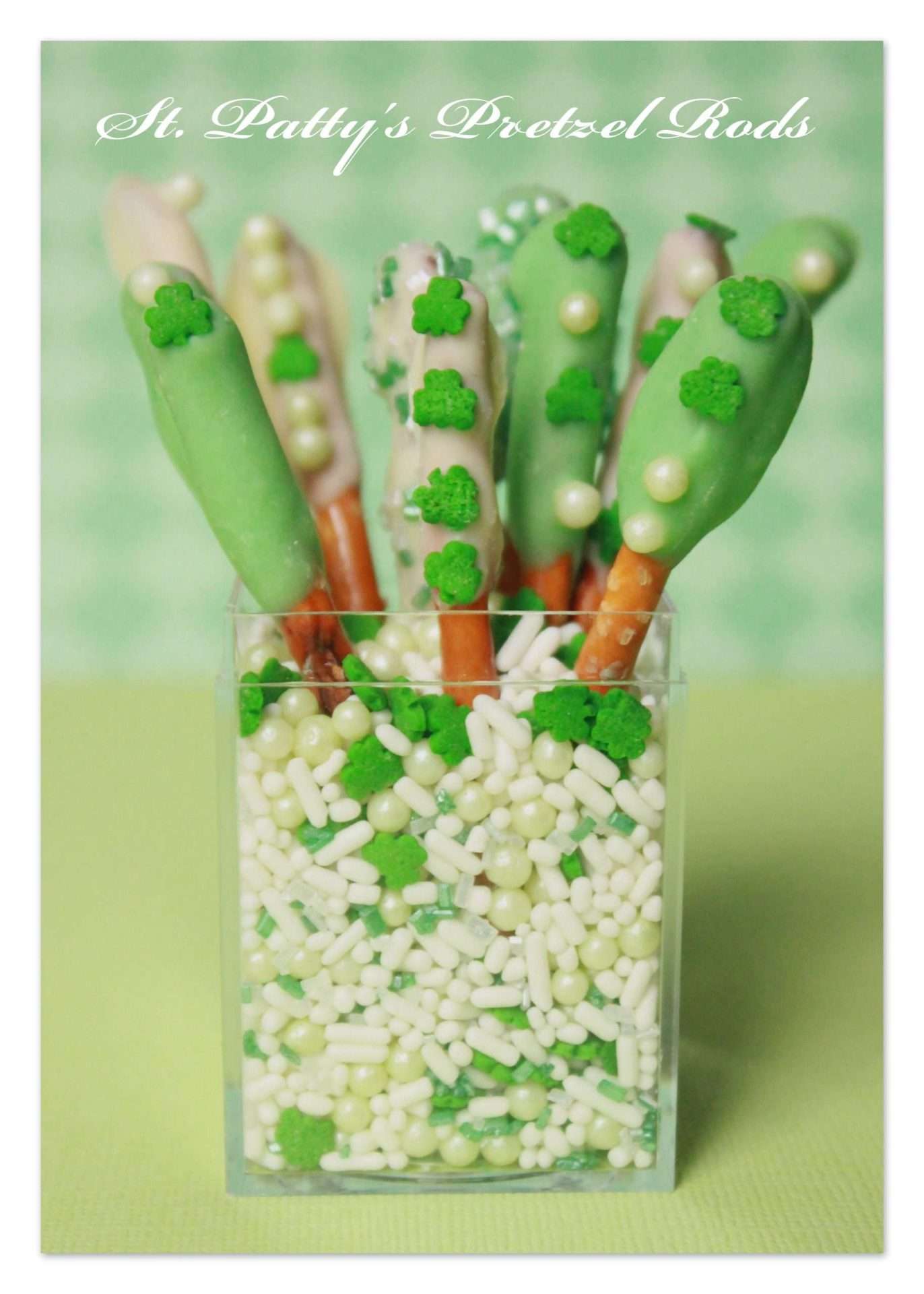 Easy and fun chocolate dipped pretzel sticks, with tinted green chocolate and festive St. Patrick's Day sprinkles.