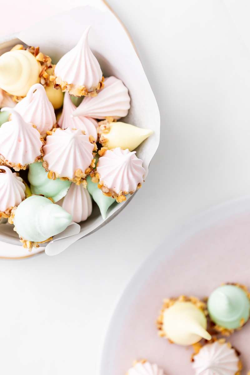 An easy recipe for making easter meringue kisses, dipped in chocolate and coated with nuts. A dairy and gluten free cookie recipe