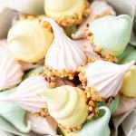 An easy recipe for making easter meringue kisses, dipped in chocolate and coated with nuts. A dairy and gluten free cookie recipe