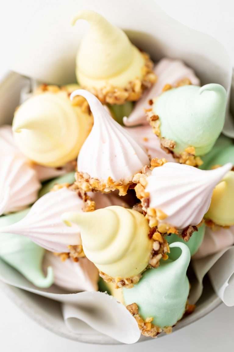 An easy recipe for making easter meringue kisses, dipped in chocolate and coated with nuts. A dairy and gluten free cookie recipe