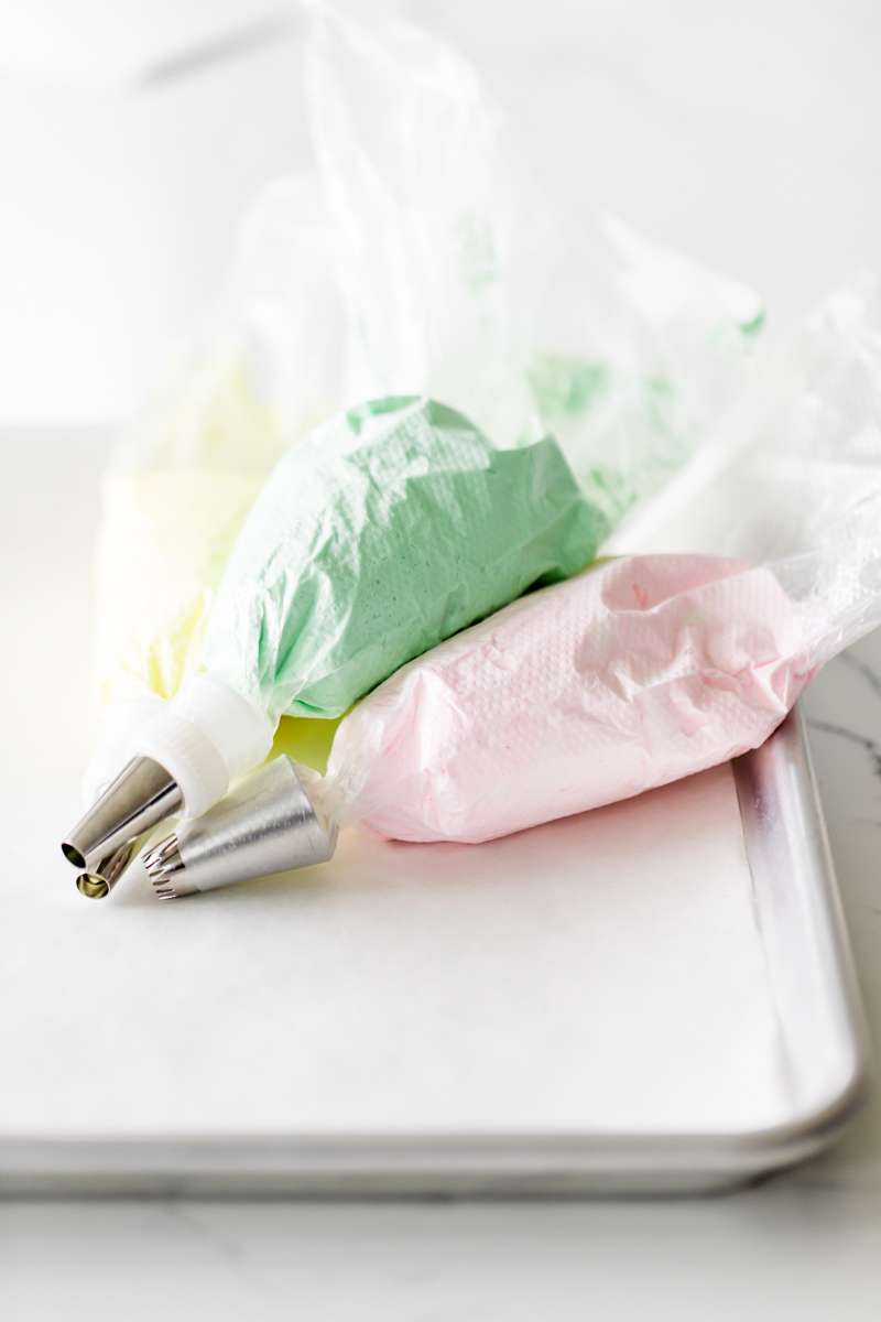 An easy recipe for making easter meringue kisses, dipped in chocolate and coated with nuts. A dairy and gluten free cookie recipe