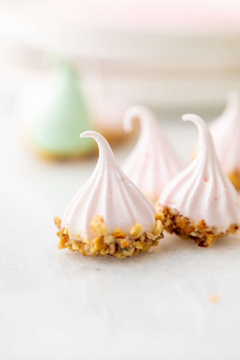 An easy recipe for making easter meringue kisses, dipped in chocolate and coated with nuts. A dairy and gluten free cookie recipe