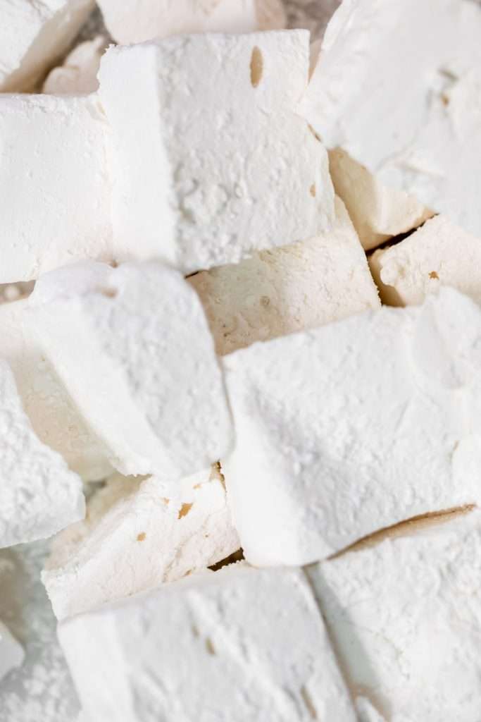 Soft and gooey homemade marshmallows for homemade s'mores macarons. These are made with fish gelatin and maple syrup in place of corn syrup and are absolutely delicious toasted!