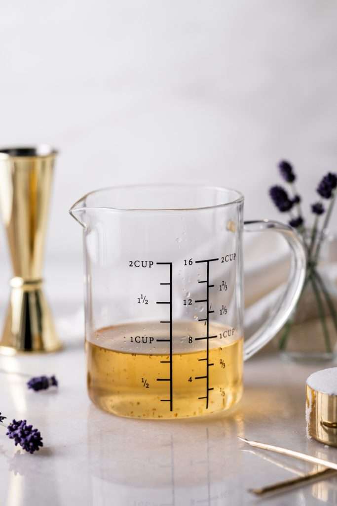Lavender simple syrup infused with lavender pods, granulated sugar and water. Just 3 ingredients and easy to make in advance for a variety of cocktails!