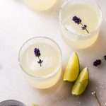Easy homemade lavender margaritas recipe, complete with lavender simple syrup, fresh squeezed lime juice cointreau and tequila. Mix in advance and enjoy at your next summer gathering!