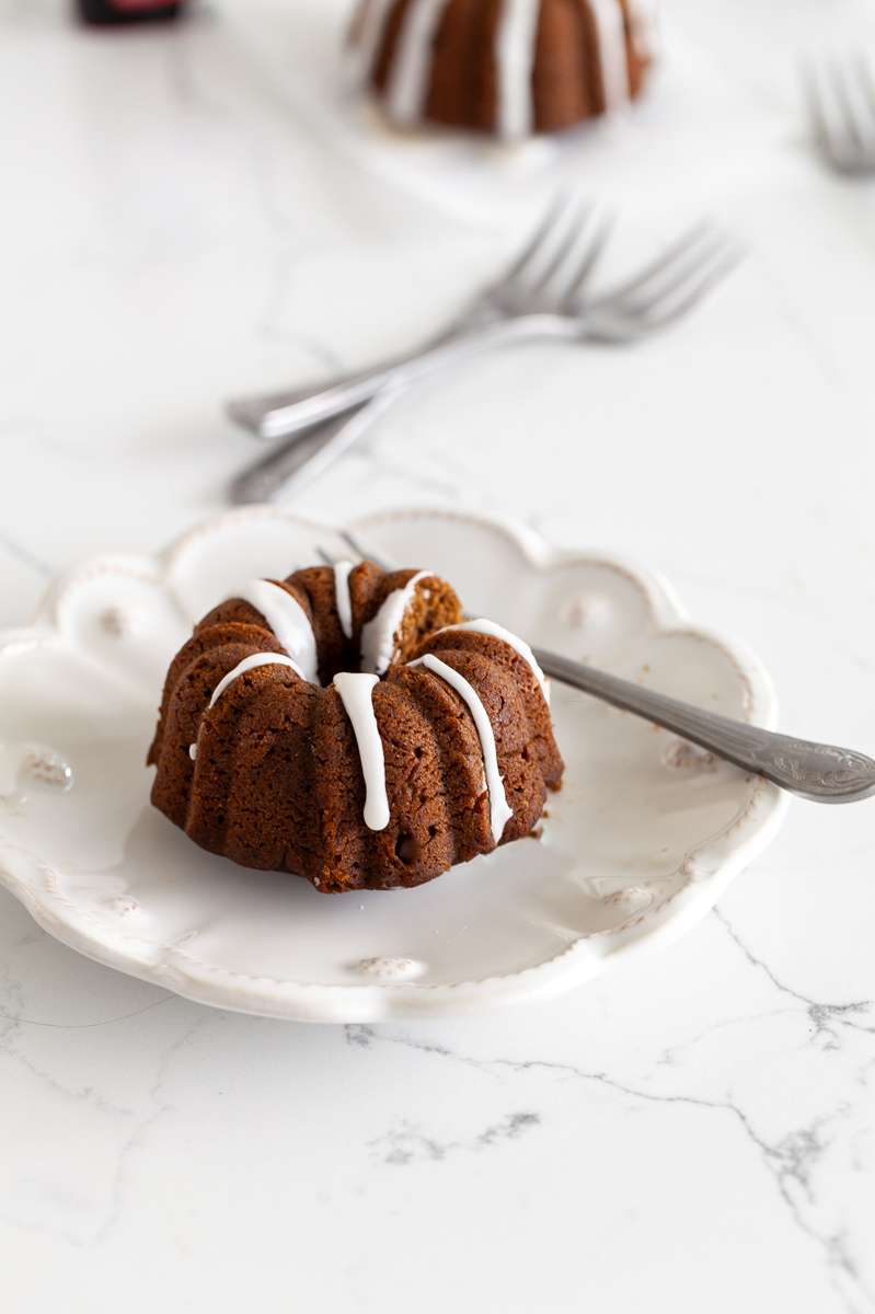 An easy recipe for Spiced Gingerbread Bundt Cakes with vanilla glaze for the holiday season