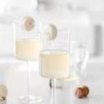 Sparkling Vanilla Macaron Cocktail recipe, made with just a few simple ingredients and a french macaron garnish.