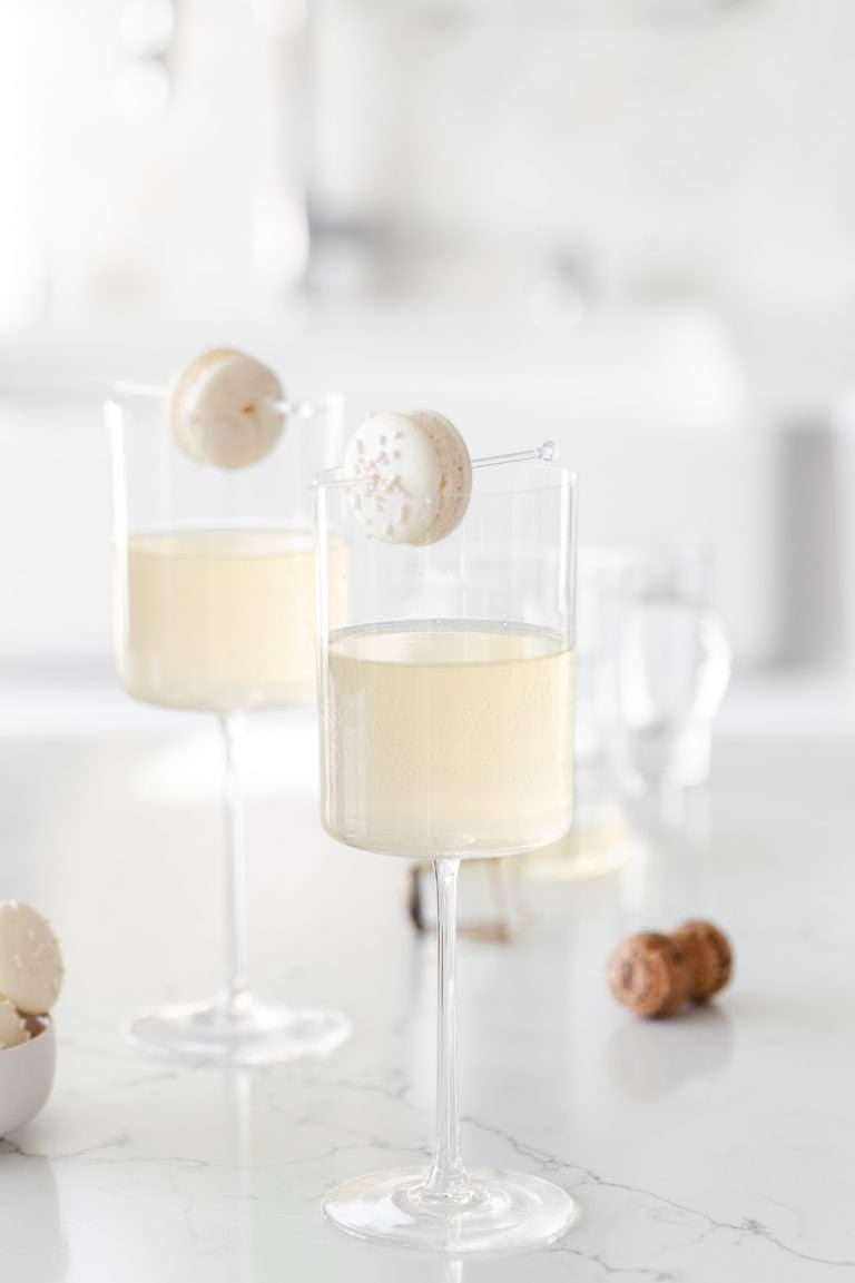 Sparkling Vanilla Macaron Cocktail recipe, made with just a few simple ingredients and a french macaron garnish.