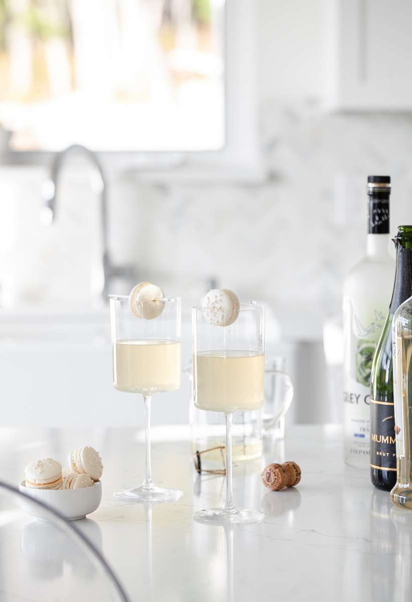 Sparkling Vanilla Macaron Cocktail recipe, made with just a few simple ingredients and a french macaron garnish.