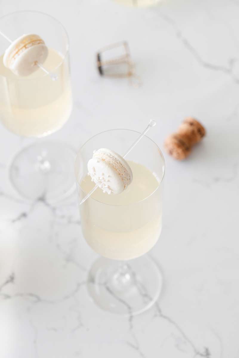 Sparkling Vanilla Macaron Cocktail recipe, made with just a few simple ingredients and a french macaron garnish.