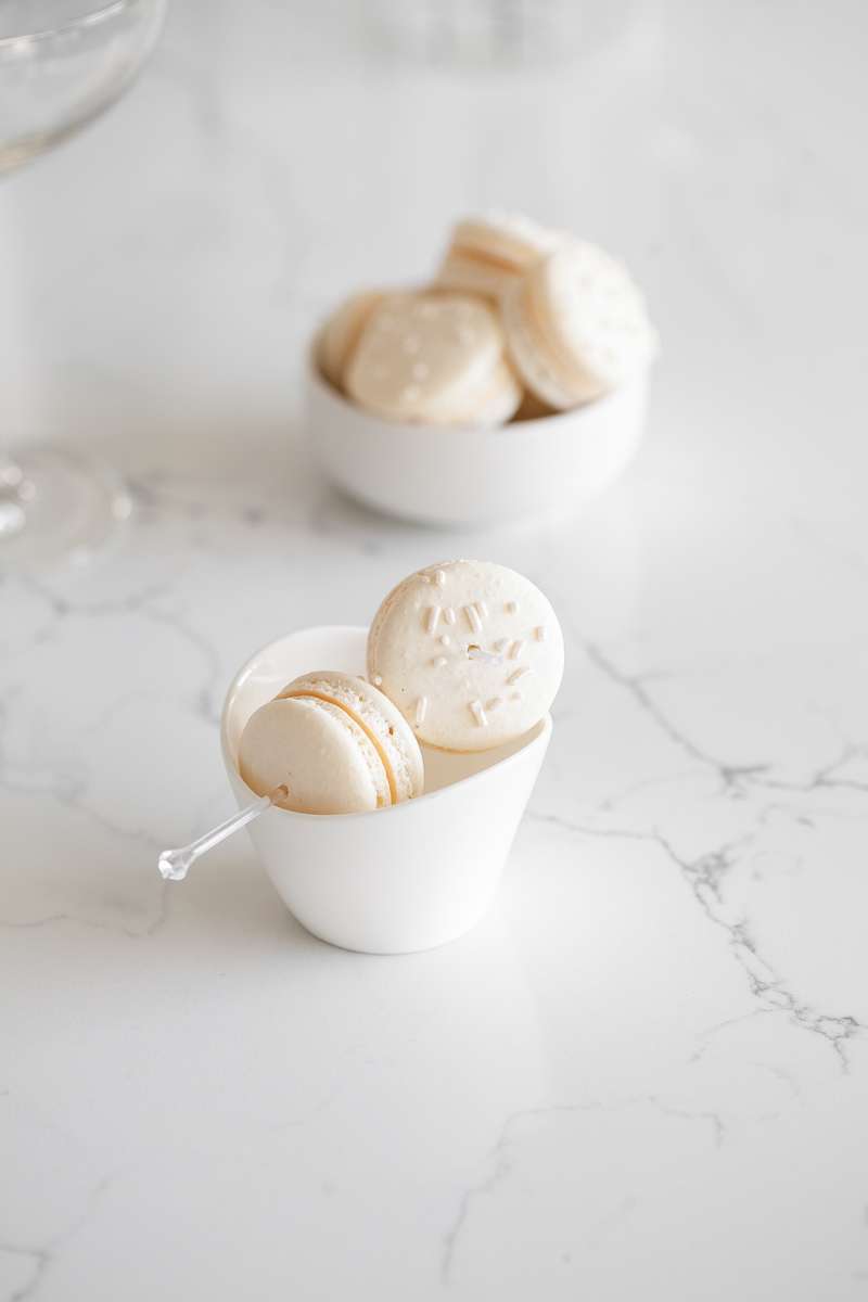 Sparkling Vanilla Macaron Cocktail recipe, made with just a few simple ingredients and a french macaron garnish.