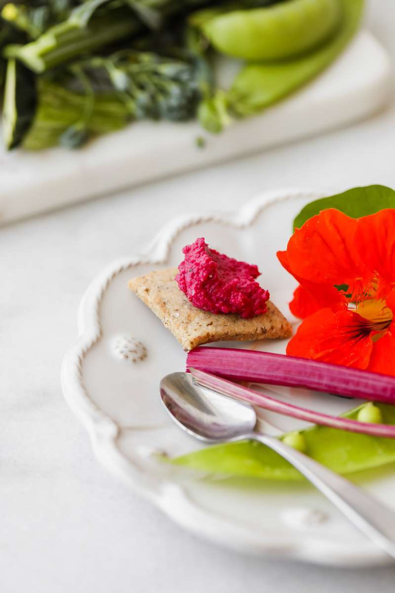 easy roasted beet hummus recipe made with garden beets and crudités - vegan & gluten free