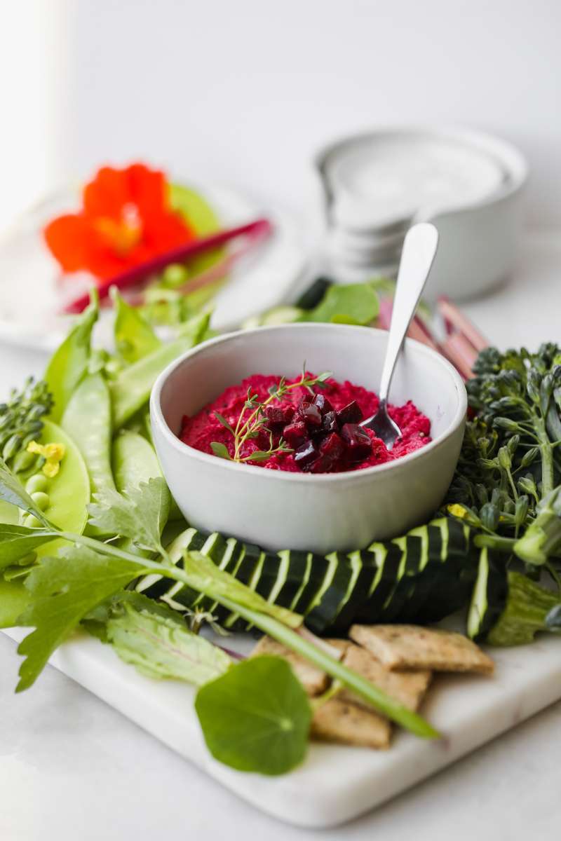 easy roasted beet hummus recipe made with garden beets and crudités - vegan & gluten free