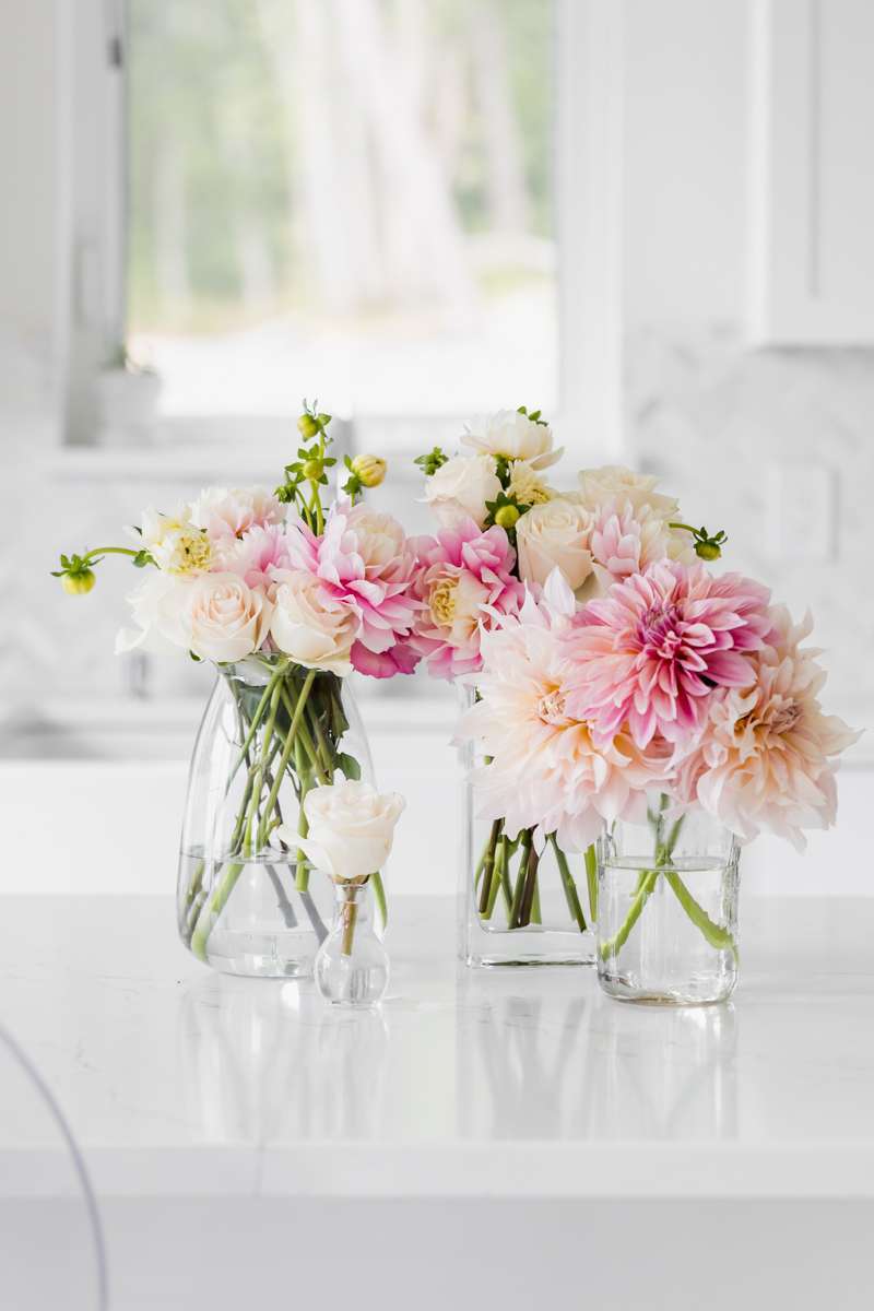 Fresh flowers in a white sink - dahlias roses