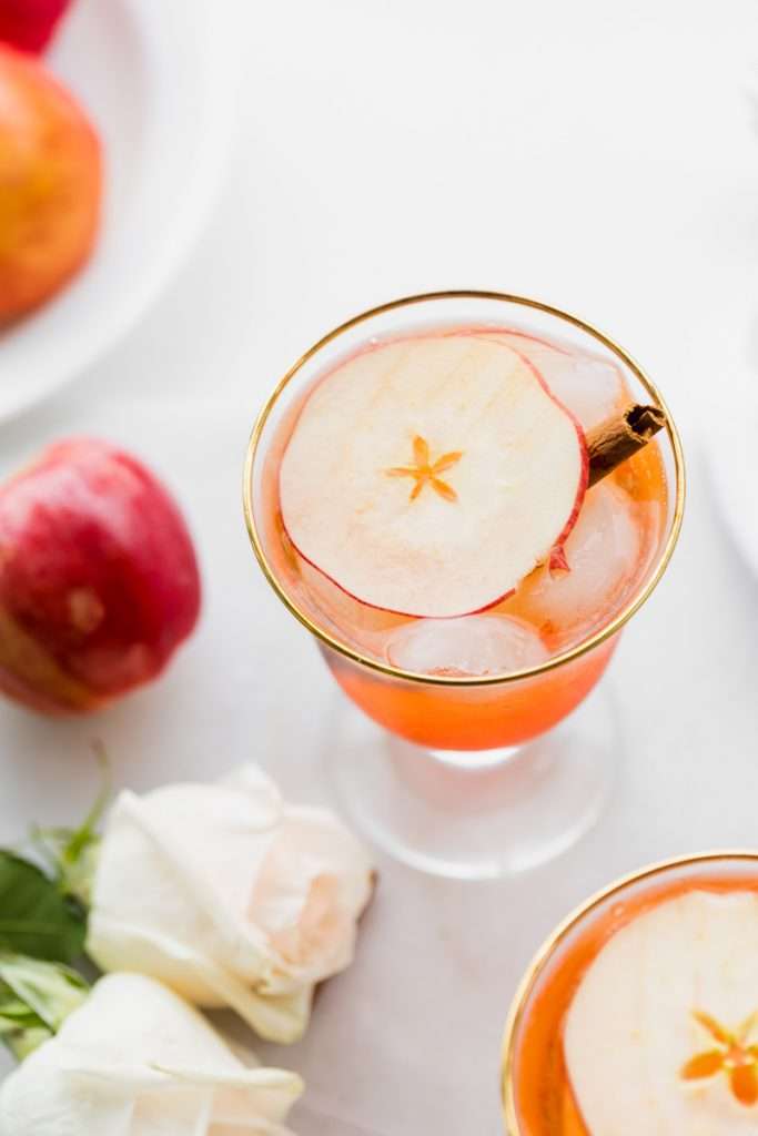 A mix of hard apple cider, Aperol and club soda garnished with cinnamon sticks and thinly sliced apple rounds, make up this light and refreshing twist on the classic Aperol Spritz. The perfect fall and autumn cocktail with warm spices. 