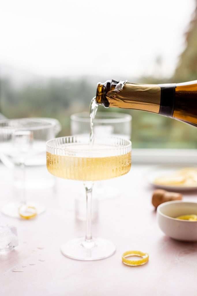 Sparkling Hummingbird cocktail made with St Germain elderflower liqueur, champagne, club soda and lemon, served over ice.