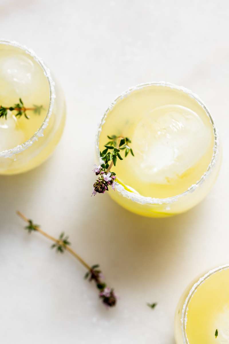 Thyme infused margaritas made with homemade thyme simple syrup, fresh lime, tequila and cointreau. The perfect herbal garden cocktail recipe for spring and summer entertaining.