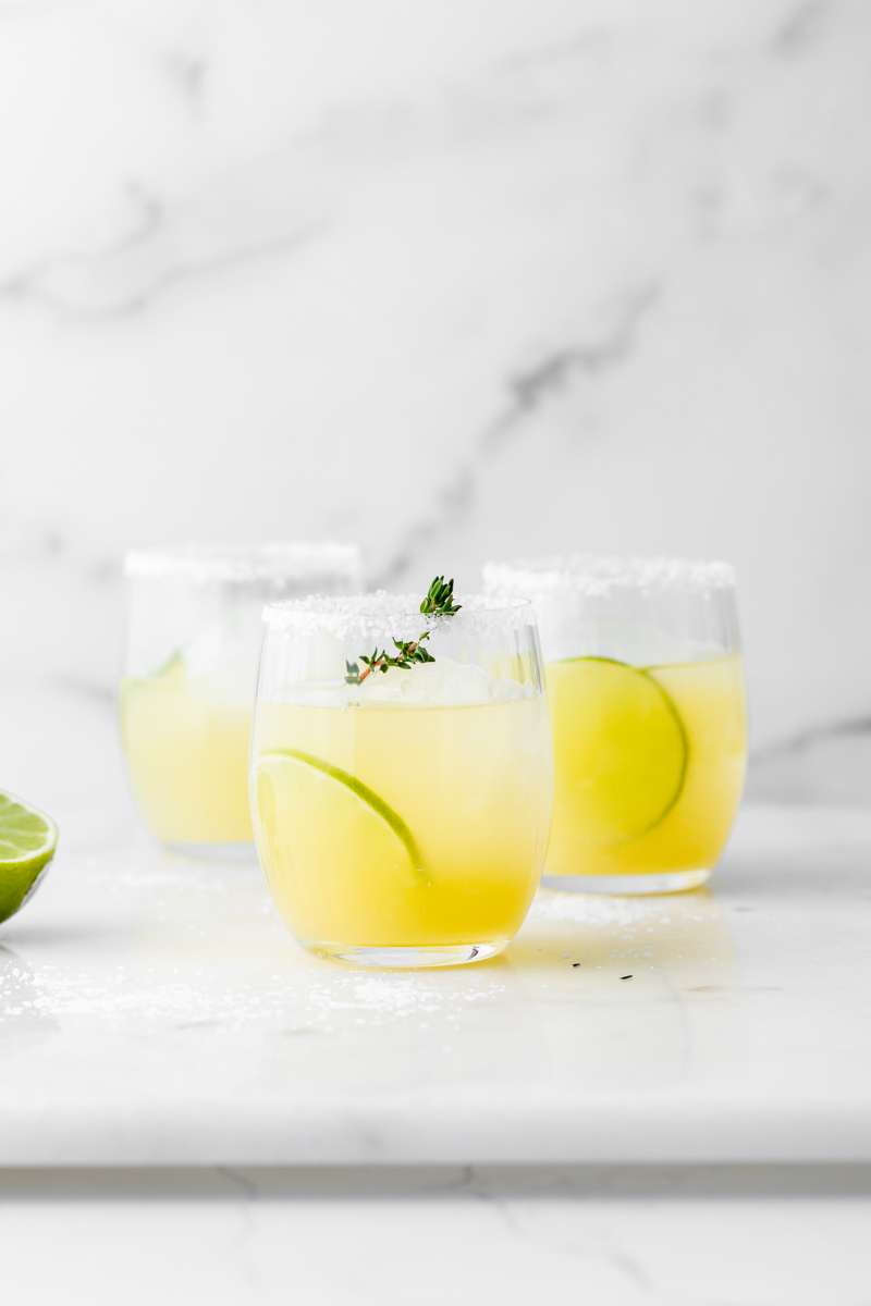 Thyme infused margaritas made with homemade thyme simple syrup, fresh lime, tequila and cointreau. The perfect herbal garden cocktail recipe for spring and summer entertaining.