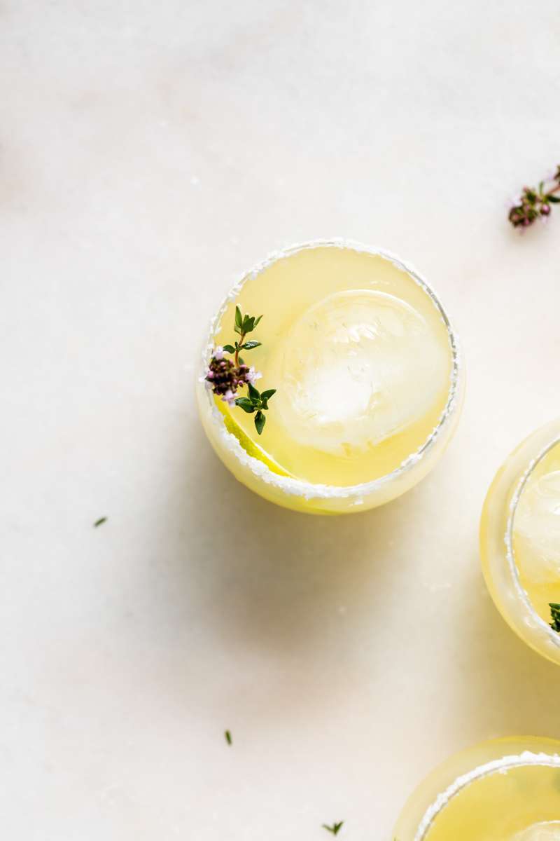 Thyme infused margaritas made with homemade thyme simple syrup, fresh lime, tequila and cointreau. The perfect herbal garden cocktail recipe for spring and summer entertaining.