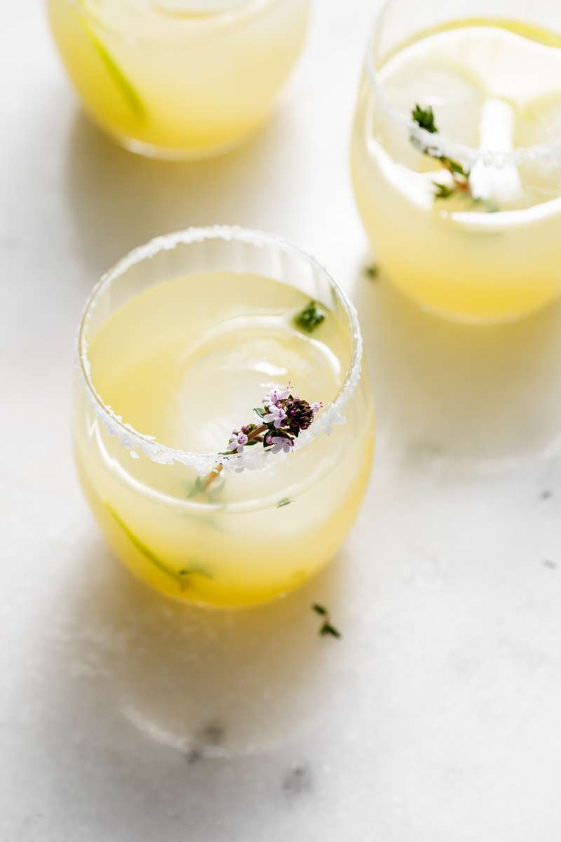 Thyme infused margaritas made with homemade thyme simple syrup, fresh lime, tequila and cointreau. The perfect herbal garden cocktail recipe for spring and summer entertaining.