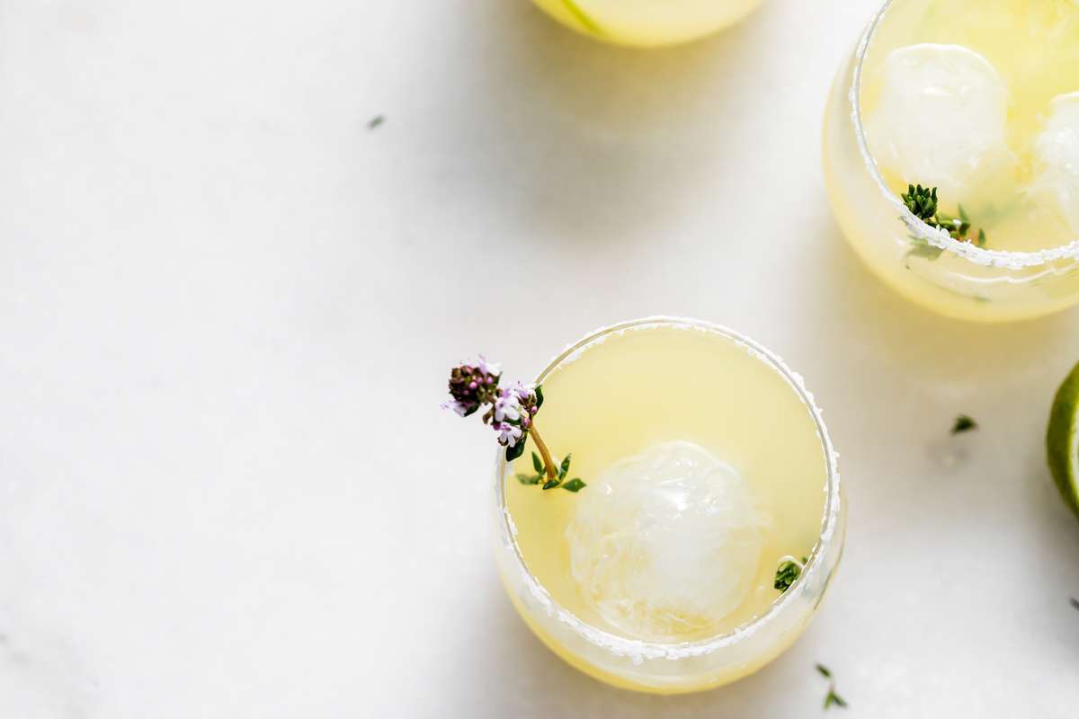 Thyme infused margaritas made with homemade thyme simple syrup, fresh lime, tequila and cointreau. The perfect herbal garden cocktail recipe for spring and summer entertaining.
