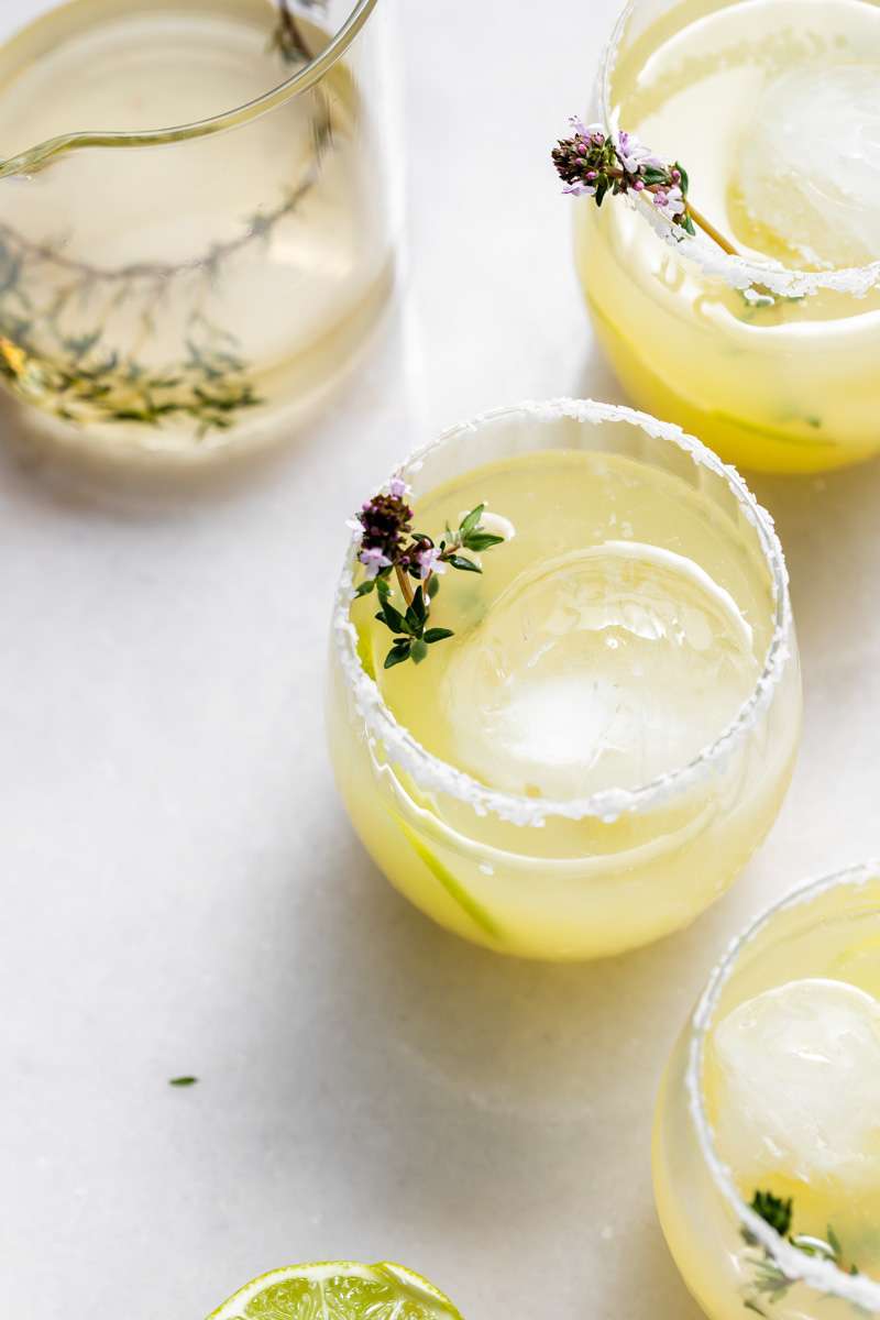 Thyme infused margaritas made with homemade thyme simple syrup, fresh lime, tequila and cointreau. The perfect herbal garden cocktail recipe for spring and summer entertaining. 