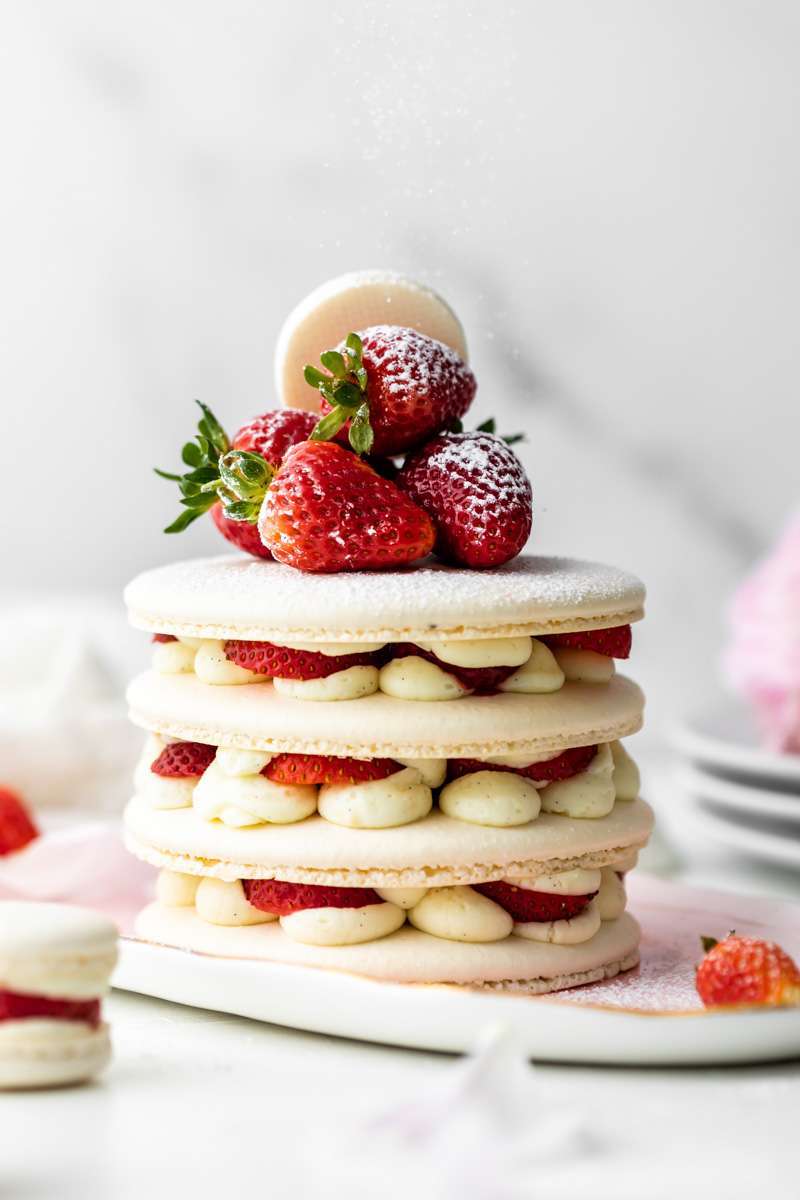 Recipe and instructions for this Fresh and delicious Strawberry Shortcake Macaron cake complete with garden strawberries, and vanilla filing. Dairy and gluten free summer recipe