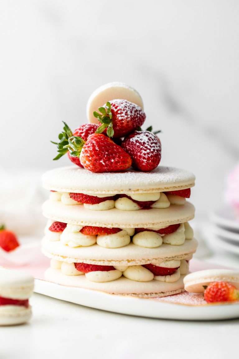 Recipe and instructions for this Fresh and delicious Strawberry Shortcake Macaron cake complete with garden strawberries, and vanilla filing. Dairy and gluten free summer recipe
