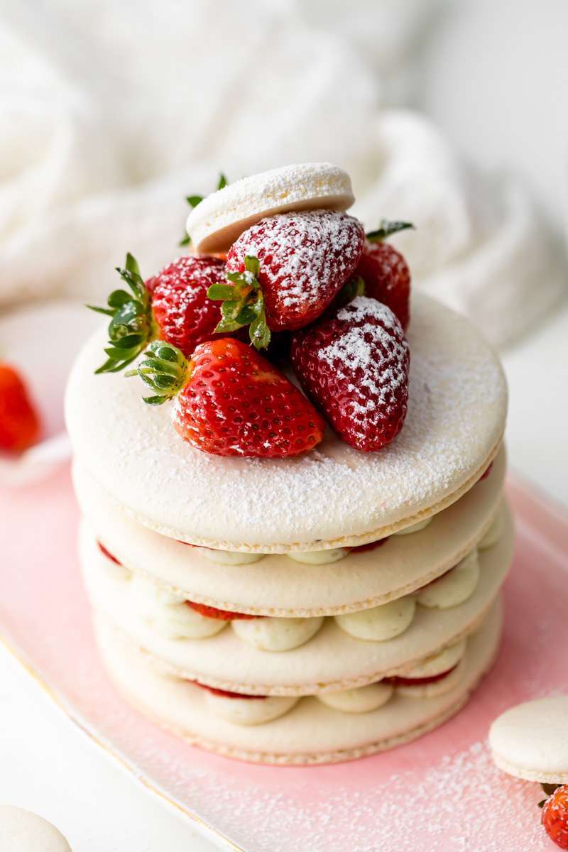 Recipe and instructions for this Fresh and delicious Strawberry Shortcake Macaron cake complete with garden strawberries, and vanilla filing. Dairy and gluten free summer recipe