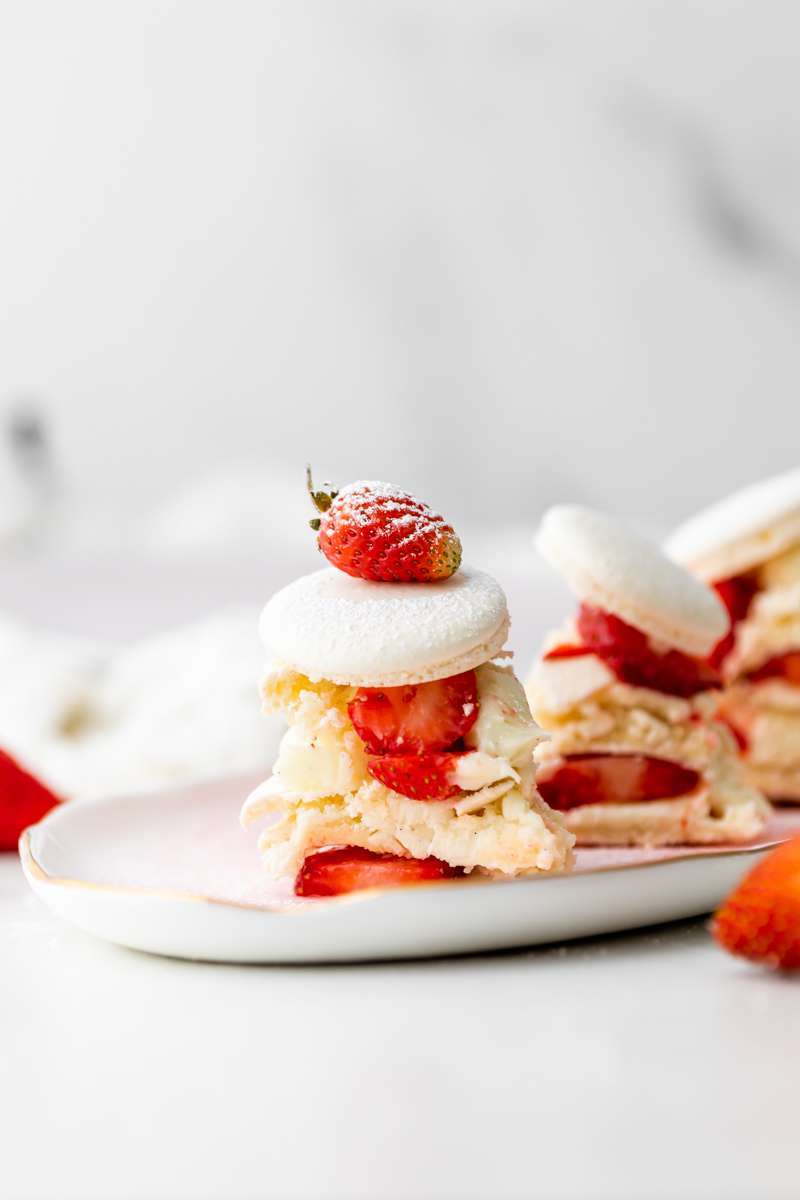 Recipe and instructions for this Fresh and delicious Strawberry Shortcake Macaron cake complete with garden strawberries, and vanilla filing. Dairy and gluten free summer recipe