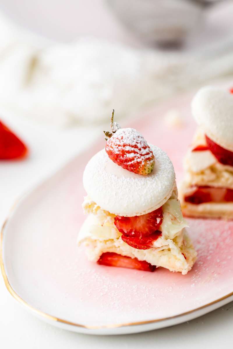 Recipe and instructions for this Fresh and delicious Strawberry Shortcake Macaron cake complete with garden strawberries, and vanilla filing. Dairy and gluten free summer recipe