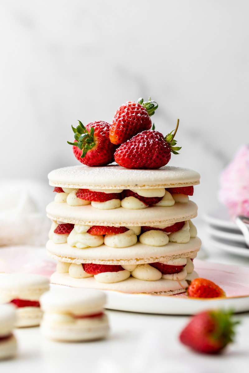 Recipe and instructions for this Fresh and delicious Strawberry Shortcake Macaron cake complete with garden strawberries, and vanilla filing. Dairy and gluten free summer recipe