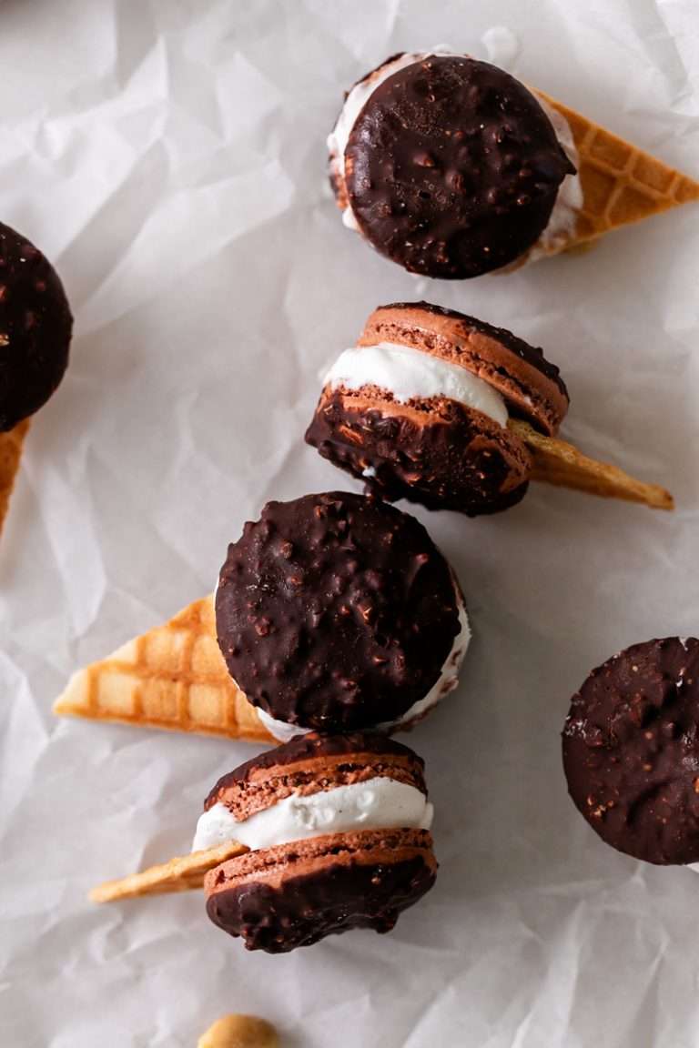 Drumstick macarons, complete with chocolate and peanut coated shells, vanilla ice cream and a waffle cone garnish. A play on the classic drumstick ice cream cone and the perfect treat to beat the summer heat!