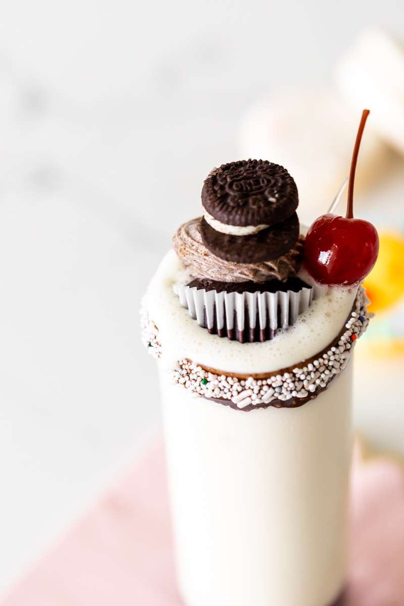 birthday milkshakes with Oreo cupcakes sprinkles and a cherry on top