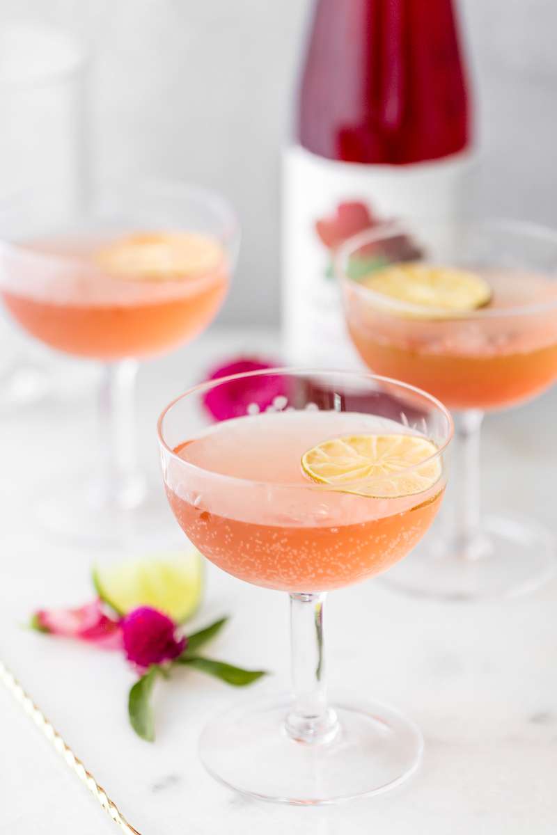 prickly pear Royale champagne cocktail recipe, made with Thatcher's Organic spirits and garnished with lime. A new twist on the classic Kir Royale