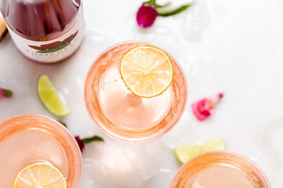 prickly pear Royale champagne cocktail recipe, made with Thatcher's Organic spirits and garnished with lime. A new twist on the classic Kir Royale