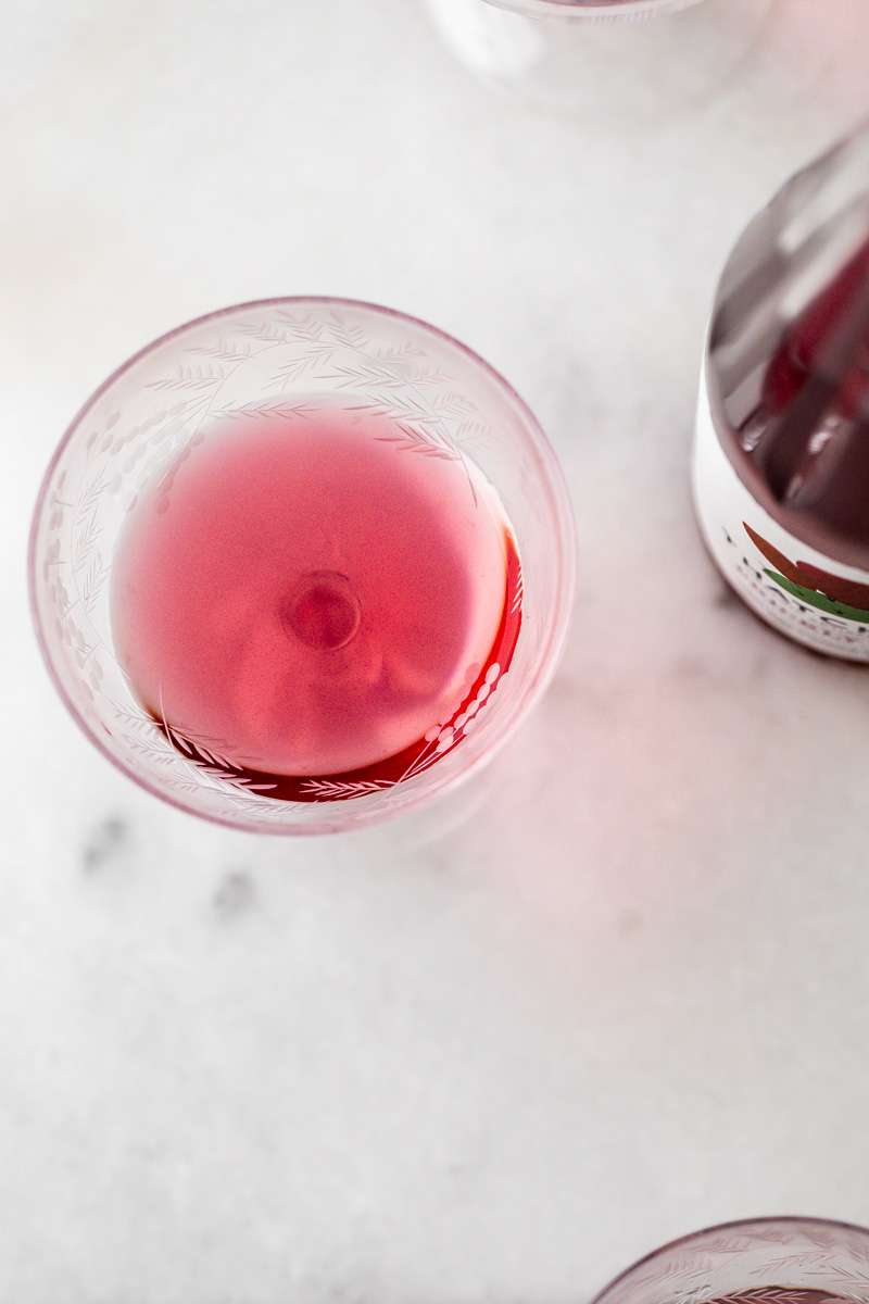 prickly pear Royale champagne cocktail recipe, made with Thatcher's Organic spirits and garnished with lime. A new twist on the classic Kir Royale