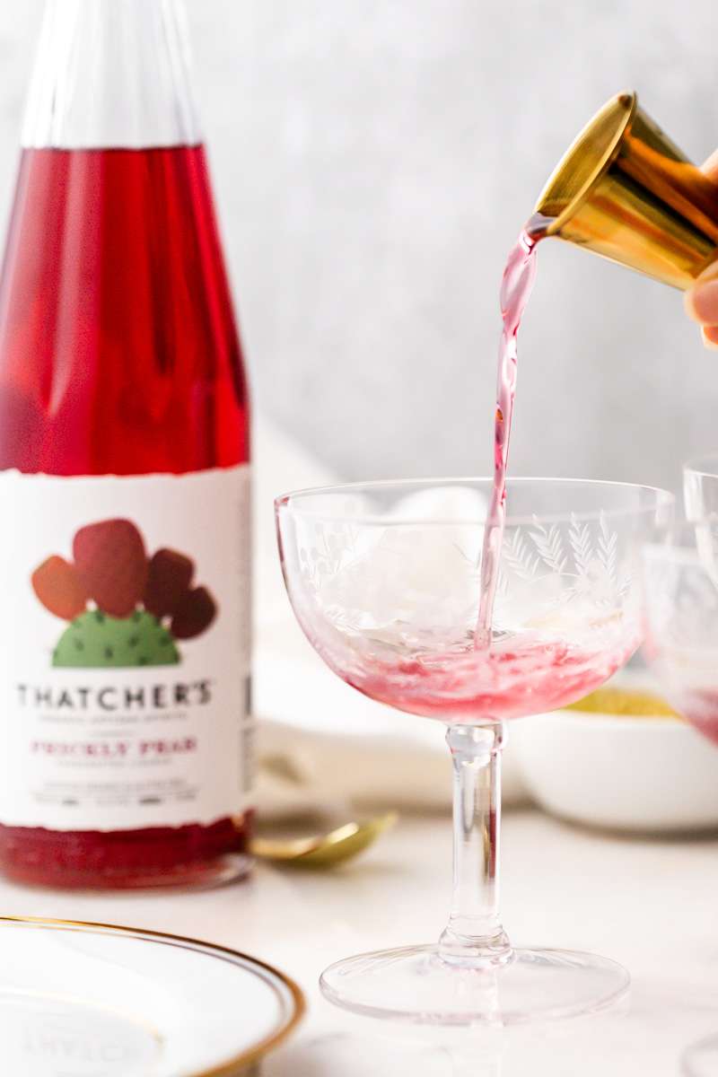 prickly pear Royale champagne cocktail recipe, made with Thatcher's Organic spirits and garnished with lime. A new twist on the classic Kir Royale