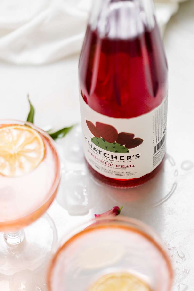 prickly pear Royale champagne cocktail recipe, made with Thatcher's Organic spirits and garnished with lime. A new twist on the classic Kir Royale