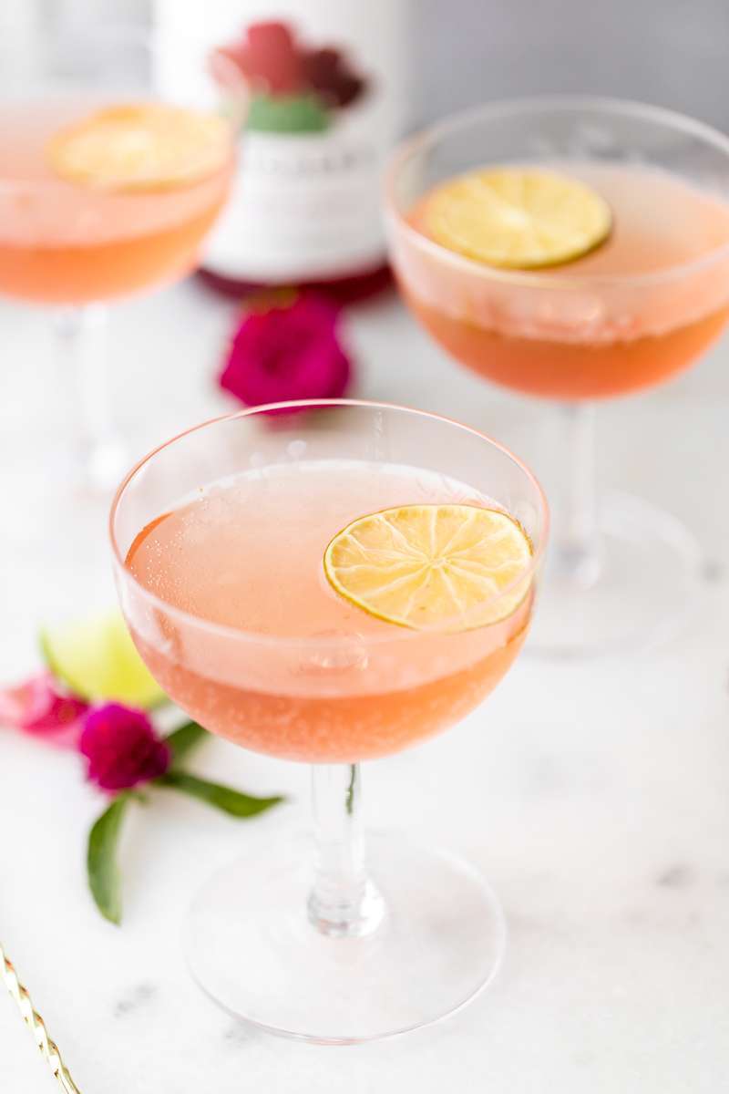 prickly pear Royale champagne cocktail recipe, made with Thatcher's Organic spirits and garnished with lime. A new twist on the classic Kir Royale