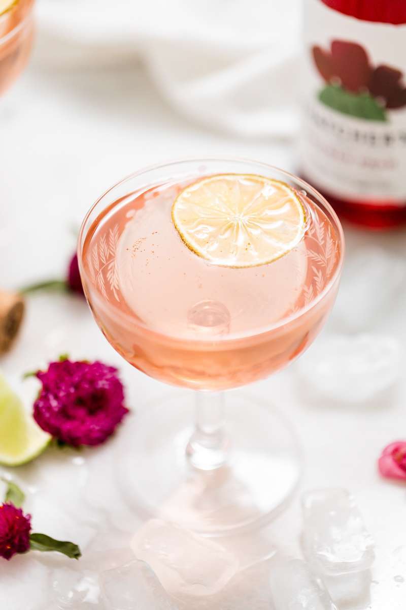 prickly pear Royale champagne cocktail recipe, made with Thatcher's Organic spirits and garnished with lime. A new twist on the classic Kir Royale