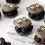 blackberry cat macarons for halloween, made with fresh blackberries, and dark chocolate ganache. Recipe and video.