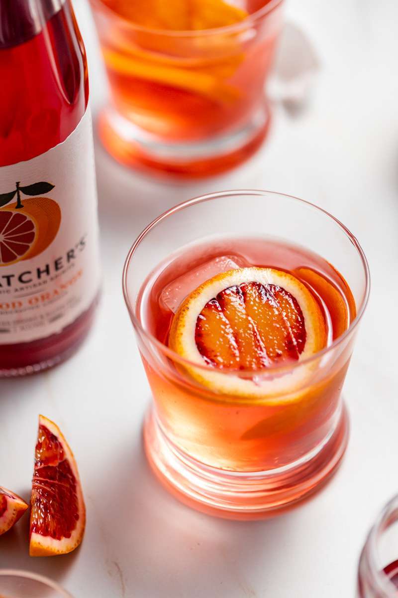 A twist on the classic Negroni infused with Blood Orange liqueur from Thatcher's Organic and fresh blood orange, served on the rocks.