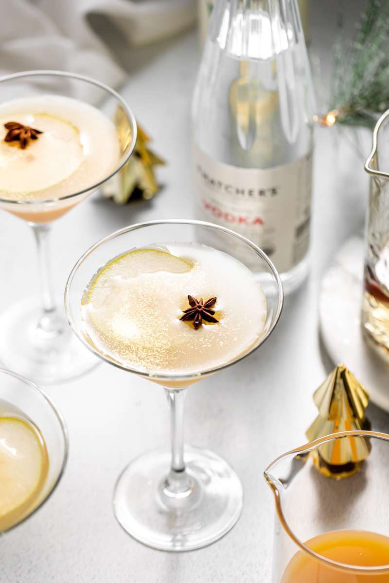 Spiced Pear Martini for the holiday season - Made with Thatcher's Organic Vodka, pear juice, elderflower and spiced simple syrup.