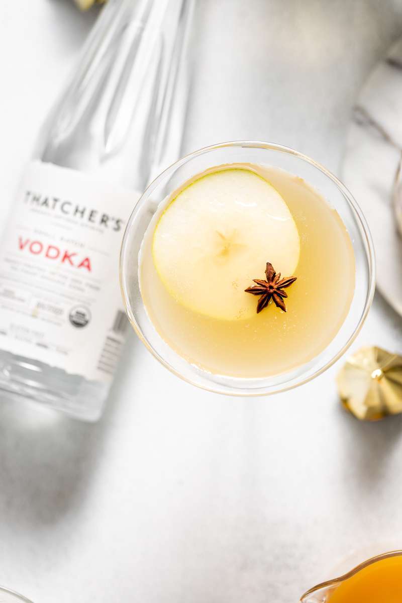 Spiced Pear Martini for the holiday season - Made with Thatcher's Organic Vodka, pear juice, elderflower and spiced simple syrup.