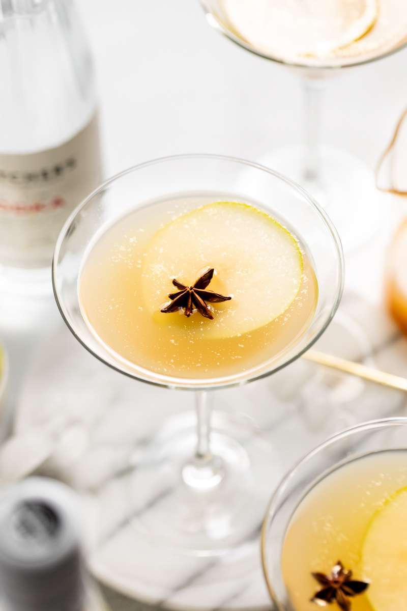 Spiced Pear Martini for the holiday season - Made with Thatcher's Organic Vodka, pear juice, elderflower and spiced simple syrup.