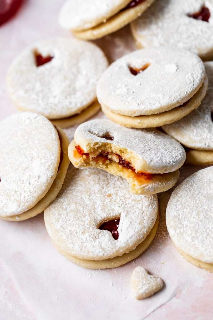 Easy dairy free linzer cookies filled with strawberry jam. Try the recipe for any holiday!