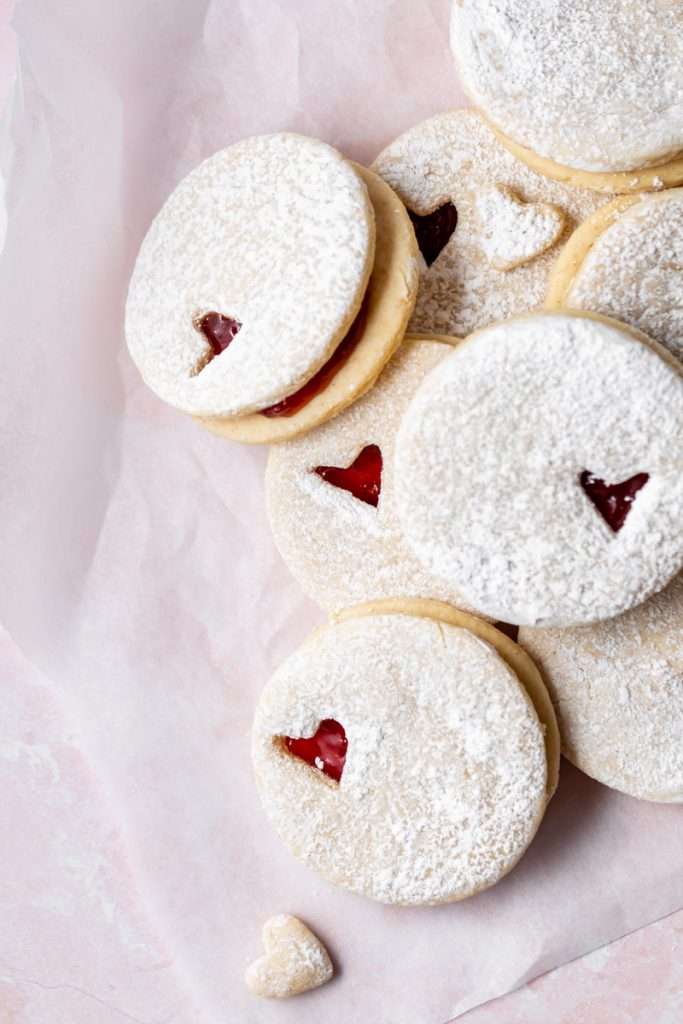 Easy dairy free linzer cookies filled with strawberry jam. Try the recipe for any holiday!