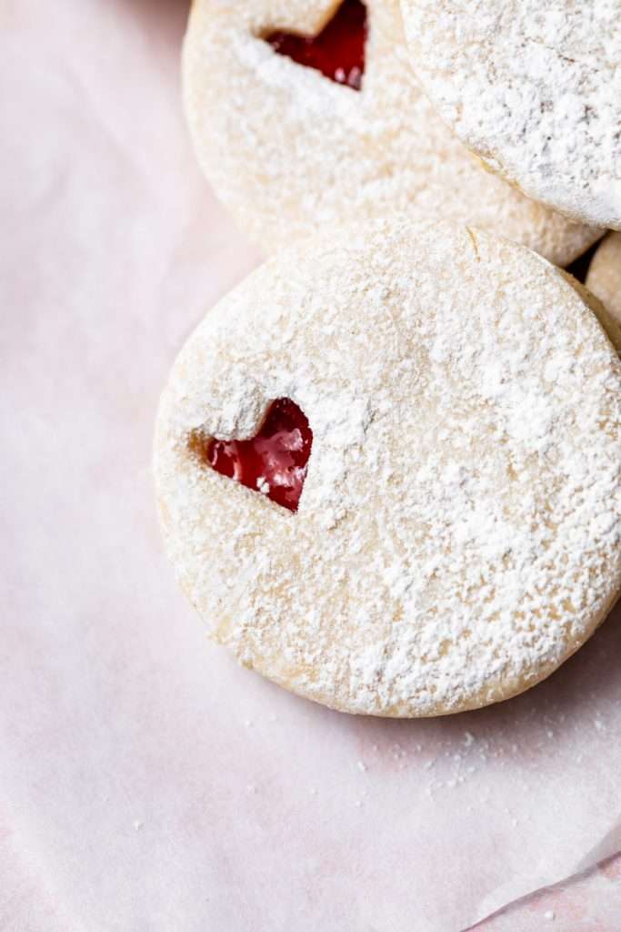 Easy dairy free linzer cookies filled with strawberry jam. Try the recipe for any holiday!