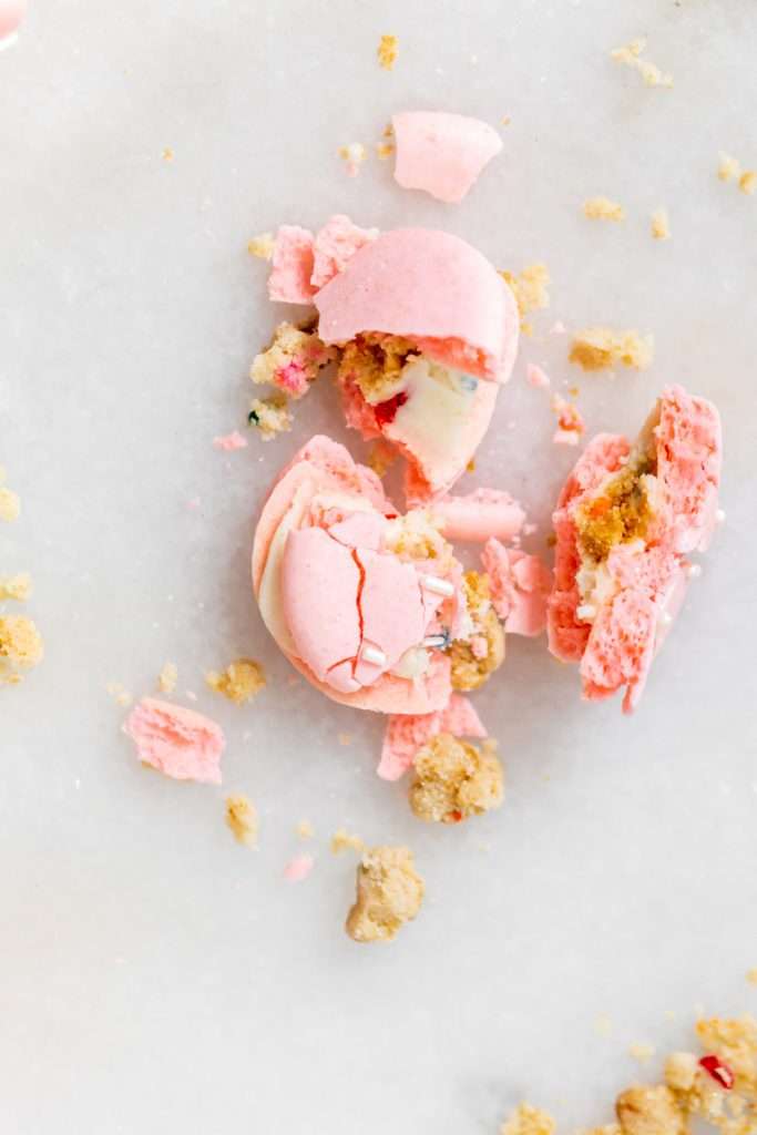 how to make birthday cake French macarons, filled with rainbow sprinkle frosting and rainbow cake crumbs. Dairy free & gluten free
